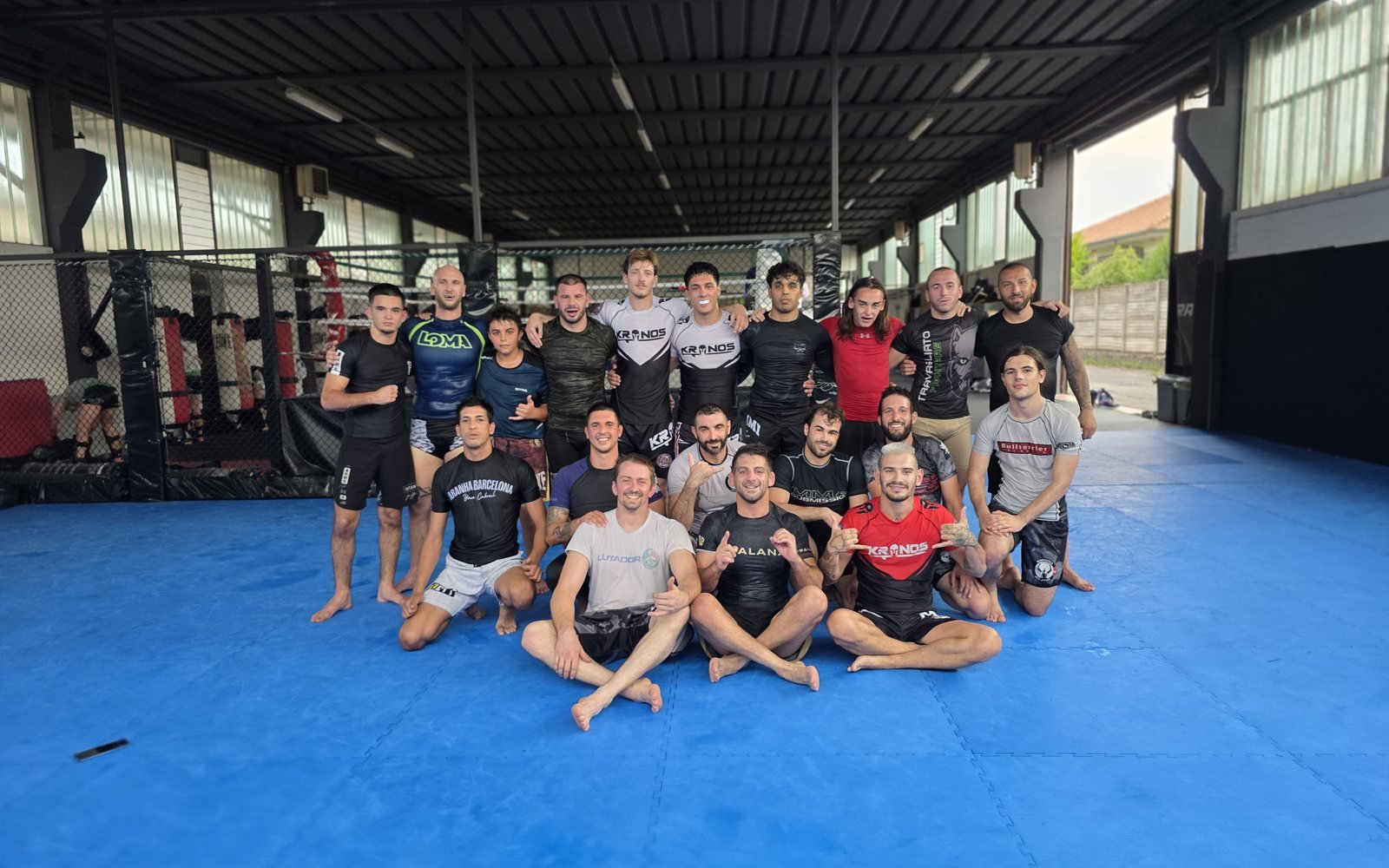 The training community together on the mats after class